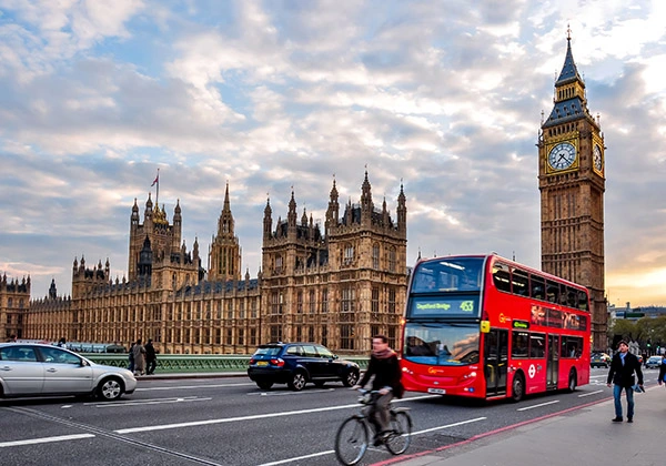 Big Ben and doubledecker bus on Westminster bridge at sunset, London, uk